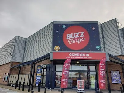 Buzz Bingo storefront with red sign and entrance on a commercial building